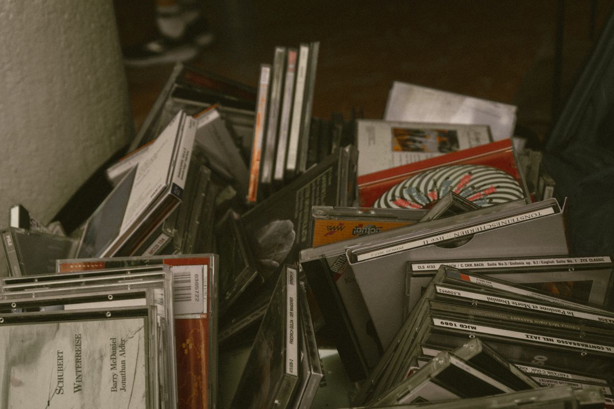 CD being lifted from an open jewel case